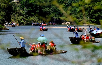 Tourists enjoy themselves in Wuyishan scenic spot in China's Fujian