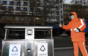 Sanitation workers disinfect garbage bins twice a day in Hefei, E China's Anhui